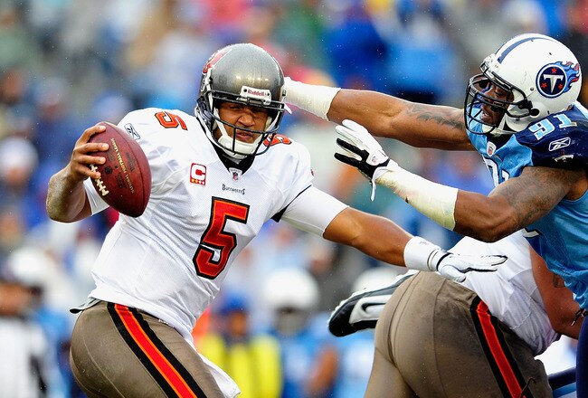 NASHVILLE, TN - NOVEMBER 27:  Jason Jones #91 of the Tennessee Titans pressures quarterback Josh Freeman #5 of the Tampa Bay Buccaneers during play at LP Field on November 27, 2011 in Nashville, Tennessee.  (Photo by Grant Halverson/Getty Images)