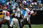 CHARLOTTE, NC - DECEMBER 06:  Josh Freeman #5 of the Tampa Bay Buccaneers drops back to pass against the Carolina Panthers at Bank of America Stadium on December 6, 2009 in Charlotte, North Carolina.  (Photo by Streeter Lecka/Getty Images)