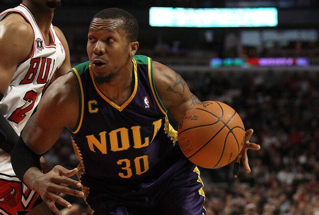 CHICAGO, IL - MARCH 07: David West #30 of the New Orleans Hornets moves against Taj Gibson #22 of the Chicago Bulls at the United Center on March 7, 2011 in Chicago, Illinois. The Bulls defeated the Hornets 85-77. NOTE TO USER: User expressly acknowledges and agrees that, by downloading and/or using this photograph, User is consenting to the terms and conditions of the Getty Images License Agreement. (Photo by Jonathan Daniel/Getty Images)