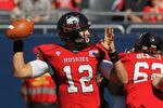 CHICAGO, IL - SEPTEMBER 17:  Chandler Harnish #12 of the Northern Illinois Huskies throws a pass against the Wisconsin Badgers at Soldier Field on September 17, 2011 in Chicago, Illinois.  (Photo by Jonathan Daniel/Getty Images)