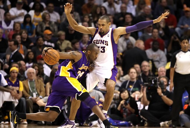 PHOENIX - JANUARY 05: Kobe Bryant #24 of the Los Angeles Lakers handles the ball under pressure from Grant Hill #33 of the Phoenix Suns during the NBA game at US Airways Center on January 5, 2011 in Phoenix, Arizona. NOTE TO USER: User expressly acknowledges and agrees that, by downloading and or using this photograph, User is consenting to the terms and conditions of the Getty Images License Agreement. (Photo by Christian Petersen/Getty Images)