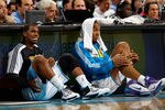 NEW ORLEANS, LA - DECEMBER 26:  Chris Paul #3 and David West #30 of the New Orleans Hornets sit on the floor before being substituted into the game while playing the Atlanta Hawks at the New Orleans Arena on December 26, 2010 in New Orleans, Louisiana.  NOTE TO USER: User expressly acknowledges and agrees that, by downloading and or using this photograph, User is consenting to the terms and conditions of the Getty Images License Agreement.  (Photo by Chris Graythen/Getty Images)