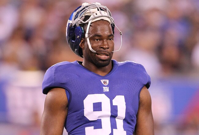 EAST RUTHERFORD, NJ - AUGUST 22: Justin Tuck #91 of the New York Giants in action during their pre season game on August 22, 2011 at The New Meadowlands Stadium in East Rutherford, New Jersey.  (Photo by Al Bello/Getty Images)