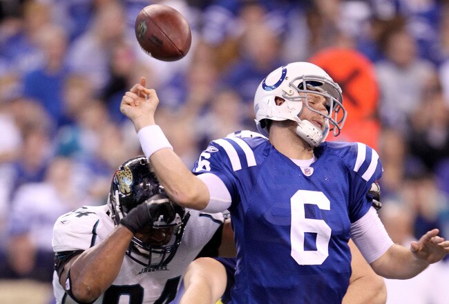 INDIANAPOLIS, IN - NOVEMBER 13: Dan Orlovsky #6  of the Indianapolis Colts fumbles the ball after being hit by Jeremy Mincey #94 of the Jacksonville Jaguars at Lucas Oil Stadium on November 13, 2011 in Indianapolis, Indiana. The Jaguars won 17-3.  (Photo by Andy Lyons/Getty Images)