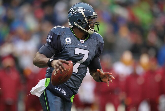 SEATTLE, WA - NOVEMBER 27:  Quarterback Tarvaris Jackson #7 of the Seattle Seahawks rolls out to pass against the Washington Redskins at CenturyLink Field on November 27, 2011 in Seattle, Washington. (Photo by Otto Greule Jr/Getty Images)