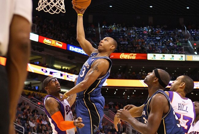 PHOENIX - DECEMBER 19:  Caron Butler #3 of the Washington Wizards lays up a shot over Amar'e Stoudemire #1 of the Phoenix Suns during the NBA game at US Airways Center on December 19, 2009 in Phoenix, Arizona. NOTE TO USER: User expressly acknowledges and agrees that, by downloading and or using this photograph, User is consenting to the terms and conditions of the Getty Images License Agreement.  (Photo by Christian Petersen/Getty Images)