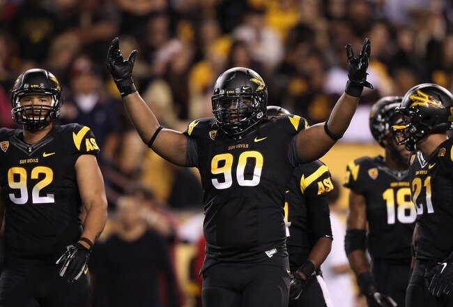 TEMPE, AZ - NOVEMBER 19:  Defensive tackle Will Sutton #90 of the Arizona State Sun Devils pumps up the crowd during the college football game against the Arizona Wildcats at Sun Devil Stadium on November 19, 2011 in Tempe, Arizona. The Wildcats defeated the Sun Devils 31-27.  (Photo by Christian Petersen/Getty Images)