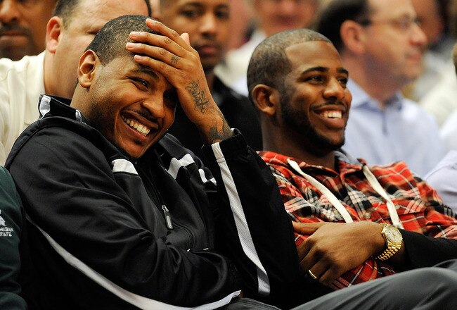 NEW YORK, NY - NOVEMBER 15:  Carmelo Anthony (L) and Chris Paul watch a game between the Duke Blue Devils and Michigan State Spartans during the 2011 State Farm Champions Classic at Madison Square Garden on November 15, 2011 in New York City.  (Photo by Patrick McDermott/Getty Images)