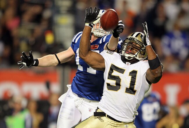 MIAMI GARDENS, FL - FEBRUARY 07: Jonathan Vilma #51 of the New Orleans Saints breaks up a pass against Austin Collie #17 of the Indianapolis Colts during Super Bowl XLIV on February 7, 2010 at Sun Life Stadium in Miami Gardens, Florida.  (Photo by Andy Lyons/Getty Images)