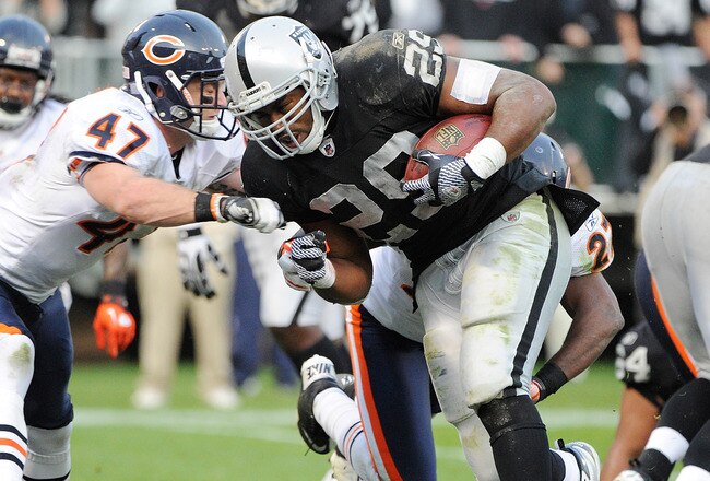 OAKLAND, CA - NOVEMBER 27:  Michael Bush #29 of the Oakland Raiders beats Chris Conte #47 of the Chicago Bears to the goal line for a three yard touchdown run in the fourth quarter at O.co Coliseum on November 27, 2011 in Oakland, California.  (Photo by Thearon W. Henderson/Getty Images)