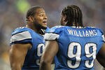 DETROIT, MI - NOVEMBER 24:  Ndamukong Suh #90 of the Detroit Lions talks with teammate Corey Williams #99 during the game against the Green Bay Packers at Ford Field on November 24, 2011 in Detroit, Michigan. The Packers defeated the Lions 27-15. (Photo by Leon Halip/Getty Images)