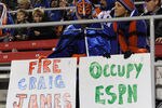 LAS VEGAS, NV - NOVEMBER 05:  Boise State Broncos fans Tim Dudley (L) and his wife Kara Dudley of Idaho hold anti-ESPN signs during a game between the Broncos and the UNLV Rebels at Sam Boyd Stadium November 5, 2011 in Las Vegas, Nevada. Boise State won 48-21.  (Photo by Ethan Miller/Getty Images)