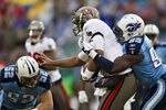 NASHVILLE, TN - NOVEMBER 27:   William Hayes #95 of the Tennessee Titans tackles Josh Freeman #5 of the Tampa Bay Buccaneers at LP Field on November 27, 2011 in Nashville, Tennessee.  The Titans defeated the Buccaneers 23 to 17.  (Photo by Wesley Hitt/Getty Images)