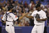 TORONTO, CANADA - SEPTEMBER 8:  J.P. Arencibia #9 and Frank Francisco #50 of the Toronto Blue Jays celebrate the win against the Boston Red Sox during MLB action at the Rogers Centre September 8, 2011 in Toronto, Ontario, Canada. (Photo by Abelimages/Getty Images)