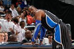 ATLANTA, GA - APRIL 28:  Dwight Howard #12 of the Orlando Magic stands at the scorer's table after being earning a technical foul against Zaza Pachulia #27 of the Atlanta Hawks during Game Six of the Eastern Conference Quarterfinals in the 2011 NBA Playoffs at Philips Arena on April 28, 2011 in Atlanta, Georgia.  NOTE TO USER: User expressly acknowledges and agrees that, by downloading and or using this photograph, User is consenting to the terms and conditions of the Getty Images License Agreement.  (Photo by Kevin C. Cox/Getty Images)