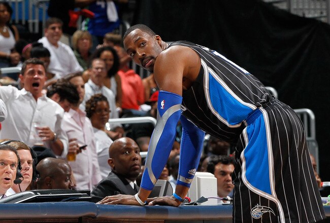 ATLANTA, GA - APRIL 28:  Dwight Howard #12 of the Orlando Magic stands at the scorer's table after being earning a technical foul against Zaza Pachulia #27 of the Atlanta Hawks during Game Six of the Eastern Conference Quarterfinals in the 2011 NBA Playoffs at Philips Arena on April 28, 2011 in Atlanta, Georgia.  NOTE TO USER: User expressly acknowledges and agrees that, by downloading and or using this photograph, User is consenting to the terms and conditions of the Getty Images License Agreement.  (Photo by Kevin C. Cox/Getty Images)