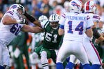 ORCHARD PARK, NY - NOVEMBER 06: Aaron Maybin #51 of the New York Jets rushes in on Ryan Fitzpatrick #14 of the Buffalo Bills at Ralph Wilson Stadium on November 6, 2011 in Orchard Park, New York.New York won 27-11.  (Photo by Rick Stewart/Getty Images)