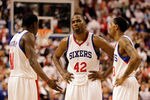 PHILADELPHIA, PA - APRIL 21: Elton Brand #42 of the Philadelphia 76ers talks with teammates Jrue Holiday #11 (L) and Lou Williams #23 (R)  during the closing moments of their game against the Miami Heat during game three of the Eastern Conference Quarterfinals at Wells Fargo Center on April 21, 2011 in Philadelphia, Pennsylvania.NOTE TO USER: User expressly acknowledges and agrees that, by downloading and/or using this Photograph, User is consenting to the terms and conditions of the Getty Images License Agreement.  (Photo by Rob Carr/Getty Images)