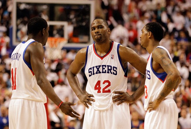 PHILADELPHIA, PA - APRIL 21: Elton Brand #42 of the Philadelphia 76ers talks with teammates Jrue Holiday #11 (L) and Lou Williams #23 (R)  during the closing moments of their game against the Miami Heat during game three of the Eastern Conference Quarterfinals at Wells Fargo Center on April 21, 2011 in Philadelphia, Pennsylvania.NOTE TO USER: User expressly acknowledges and agrees that, by downloading and/or using this Photograph, User is consenting to the terms and conditions of the Getty Images License Agreement.  (Photo by Rob Carr/Getty Images)