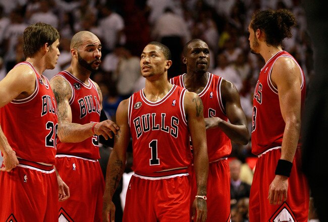MIAMI, FL - MAY 24:  (L-R) Kyle Korver #26, Carlos Boozer #5, Derrick Rose #1, Luol Deng #9 and Joakim Noah #13 of the Chicago Bulls talk on court against the Miami Heat in Game Four of the Eastern Conference Finals during the 2011 NBA Playoffs on May 24, 2011 at American Airlines Arena in Miami, Florida. The Heat won 101-93 in overtime. NOTE TO USER: User expressly acknowledges and agrees that, by downloading and or using this photograph, User is consenting to the terms and conditions of the Getty Images License Agreement.  (Photo by Marc Serota/Getty Images)