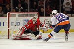 CHICAGO, IL - DECEMBER 02: Corey Crawford #50 of the Chicago Blackhawks defelects a shot by Matt Moulson #26 of the New York Islanders during a shootout at the United Center on December 2, 2011 in Chicago, Illinois. The Blkackhawks defeated the Islanders 5-4 in a shootout. (Photo by Jonathan Daniel/Getty Images)