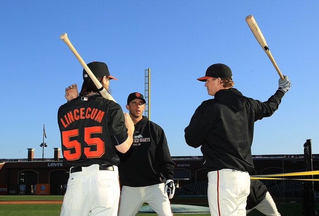 SAN FRANCISCO - OCTOBER 18:  Tim Lincecum #55 of the San Francisco Giants speaks to Matt Cain #18 and Madison Bumgarner #40 during a workout session for the NLCS at AT&T Park on October 18, 2010 in San Francisco, California.  (Photo by Ezra Shaw/Getty Images)