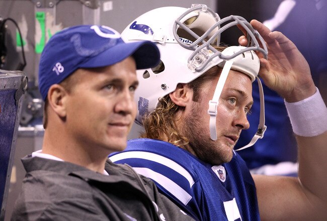 INDIANAPOLIS, IN - NOVEMBER 27:  Peyton Manning and Curtis Painter #7 of the Indianapolis Colts sit on the bench in the final minute of the game against the Carolina Panthers at Lucas Oil Stadium on November 27, 2011 in Indianapolis, Indiana.  The colts lost 27-19.  (Photo by Andy Lyons/Getty Images)
