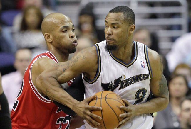 WASHINGTON, DC - FEBRUARY 28: Taj Gibson #22 of the Chicago Bulls guards Rashard Lewis #9 of the Washington Wizards at the Verizon Center in Washington on February 28, 2011 in Washington, DC. NOTE TO USER: User expressly acknowledges and agrees that, by downloading and/or using this Photograph, User is consenting to the terms and conditions of the Getty Images License Agreement.  (Photo by Rob Carr/Getty Images)