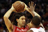 MIAMI, FL - MARCH 27:  Forward Chris Bosh #1 of the Miami Heat defends against Forward Luis Scola #4 of the Houston Rockets at American Airlines Arena on March 27, 2011 in Miami, Florida. NOTE TO USER: User expressly acknowledges and agrees that, by downloading and/or using this Photograph, User is consenting to the terms and conditions of the Getty Images License Agreement.  (Photo by Marc Serota/Getty Images)