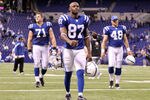 INDIANAPOLIS, IN - NOVEMBER 27:  Reggie Wayne #87 of the Indianapolis Colts walks off of the field after the Colts lost 27-19 to Carolina Panthers at Lucas Oil Stadium on November 27, 2011 in Indianapolis, Indiana.  (Photo by Andy Lyons/Getty Images)