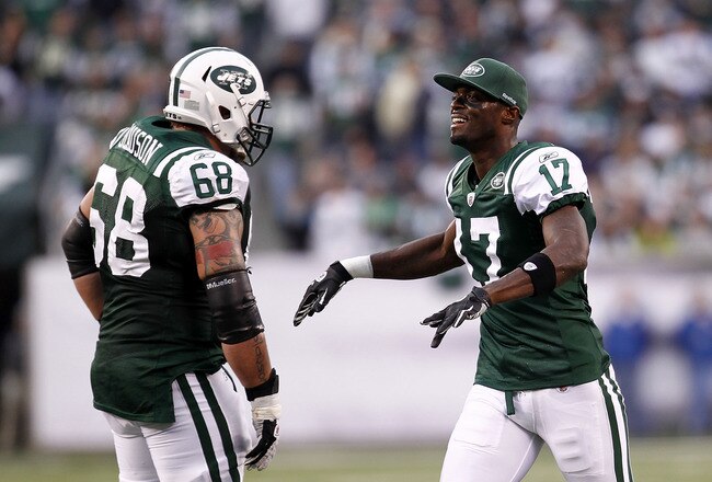 EAST RUTHERFORD, NJ - NOVEMBER 27:  Plaxico Burress #17 of the New York Jets celebrates with teammate Matt Slauson #68 against the Buffalo Bills during their game at MetLife Stadium on November 27, 2011 in East Rutherford, New Jersey.  (Photo by Jeff Zelevansky/Getty Images)