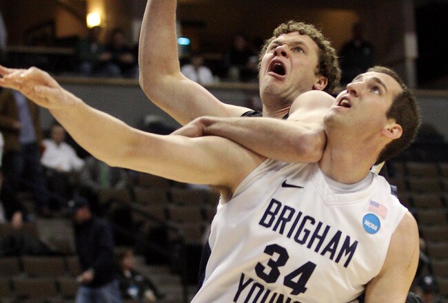 DENVER, CO - MARCH 17:  Noah Hartsock #34 of the Brigham Young Cougars fights for position against Noah Dahlman #42 of the Wofford Terriers during the second round of the 2011 NCAA men's basketball tournament at Pepsi Center on March 17, 2011 in Denver, Colorado.  (Photo by Justin Edmonds/Getty Images)