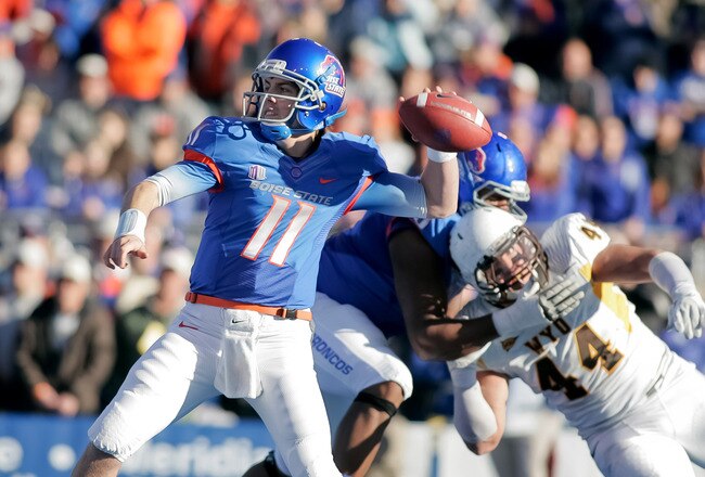BOISE, ID - NOVEMBER 26:  Kellen Moore #11 of the Boise State Broncos passes against the Wyoming Cowboys at Bronco Stadium on November 26, 2011 in Boise, Idaho.  (Photo by Otto Kitsinger III/Getty Images)
