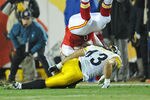 KANSAS CITY, MO - NOVEMBER 27:  Strong safety Troy Polamalu #43 of the Pittsburgh Steelers goes down with a head injury after making a tackle on offensive tackle Steve Maneri #68 of the Kansas City Chiefs during the first quarter on November 27, 2011 at Arrowhead Stadium in Kansas City, Missouri.  Pittsburgh defeated Kansas City 13-9.  (Photo by Peter Aiken/Getty Images)