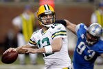 DETROIT, MI - NOVEMBER 24:  Quarterback Aaron Rodgers #12 of the Green Bay Packers looks to pass as defensive end Kyle Vanden Bosch #93 of the Detroit Lions rushes in during the first quarter of the Thanksgiving Day game at Ford Field on November 24, 2011 in Detroit, Michigan.  (Photo by Gregory Shamus/Getty Images)