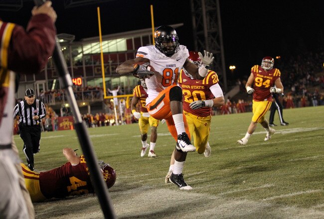 AMES, IA - NOVEMBER 18:  Justin Blackmon #81 of the Oklahoma State Cowboys tries to stay in bounds against the Iowa State Cyclones at Jack Trice Stadium November 18, 2011 in Ames, Iowa.  (Photo by Reese Strickland/Getty Images)