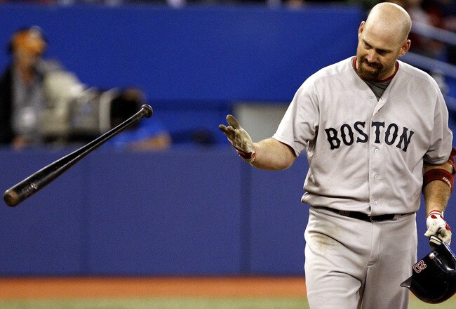 TORONTO, CANADA - SEPTEMBER 8: Kevin Youkilis #20 of the Boston Red Sox reacts to a strikeout against the Toronto Blue Jays  during MLB action at the Rogers Centre September 8, 2011 in Toronto, Ontario, Canada. (Photo by Abelimages/Getty Images)