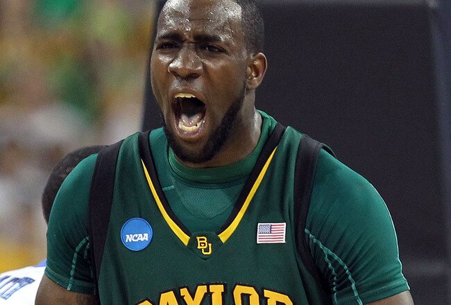 HOUSTON - MARCH 28:  Forward Quincy Acy #4 of the Baylor Bears reacts after making a slam dunk against the Duke Blue Devils during the south regional final of the 2010 NCAA men's basketball tournament at Reliant Stadium on March 28, 2010 in Houston, Texas.  (Photo by Ronald Martinez/Getty Images)