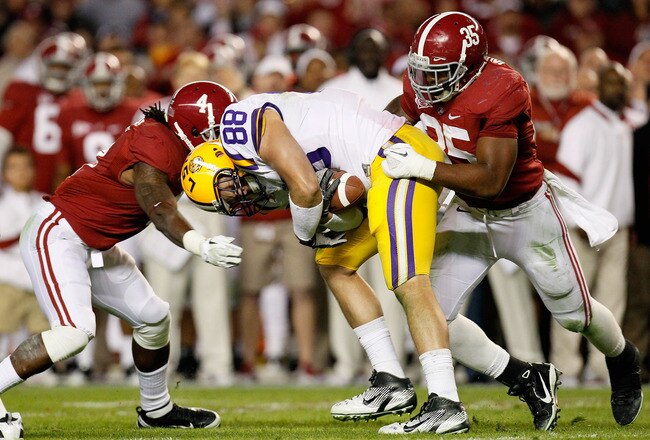 TUSCALOOSA, AL - NOVEMBER 05:  Chase Clement #88 of the LSU Tigers pulls in a reception between Nico Johnson #35 and Mark Barron #4 of the Alabama Crimson Tide during the game at Bryant-Denny Stadium on November 5, 2011 in Tuscaloosa, Alabama.  (Photo by Kevin C. Cox/Getty Images)