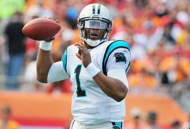 TAMPA, FL - DECEMBER 4:  Quarterback Cam Newton #1 of the Carolina Panthers sets to pass against the Tampa Bay Buccaneers December 4, 2011 at Raymond James Stadium in Tampa, Florida. (Photo by Al Messerschmidt/Getty Images)
