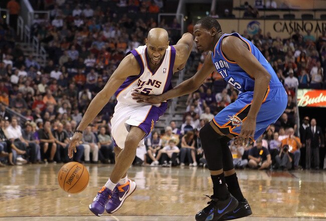 PHOENIX, AZ - MARCH 30:  Vince Carter #25 of the Phoenix Suns drives the ball past Kevin Durant #35 of the Oklahoma City Thunder during the NBA game at US Airways Center on March 30, 2011 in Phoenix, Arizona.  The Thunder defeated the Suns 116-98.  NOTE TO USER: User expressly acknowledges and agrees that, by downloading and or using this photograph, User is consenting to the terms and conditions of the Getty Images License Agreement.  (Photo by Christian Petersen/Getty Images)