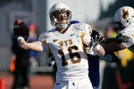 BOISE, ID - NOVEMBER 26: Brett Smith #16 of the Wyoming Cowboys passes against the Boise State Broncos at Bronco Stadium on November 26, 2011 in Boise, Idaho.  (Photo by Otto Kitsinger III/Getty Images)