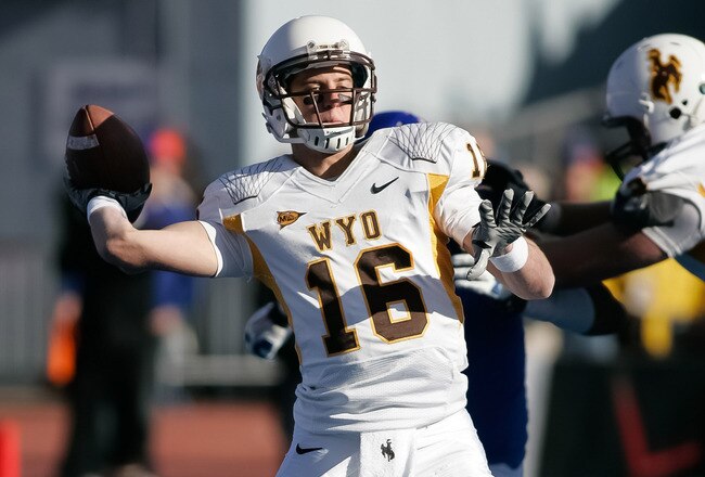 BOISE, ID - NOVEMBER 26: Brett Smith #16 of the Wyoming Cowboys passes against the Boise State Broncos at Bronco Stadium on November 26, 2011 in Boise, Idaho.  (Photo by Otto Kitsinger III/Getty Images)