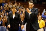 DURHAM, NC - NOVEMBER 18:  Head coach Mike Krzyzewski of the Duke Blue Devils stands with his wife Micki as he is acknowledged for breaking the record for wins in NCAA men's basketball at Cameron Indoor Stadium on November 18, 2011 in Durham, North Carolina.  (Photo by Streeter Lecka/Getty Images)