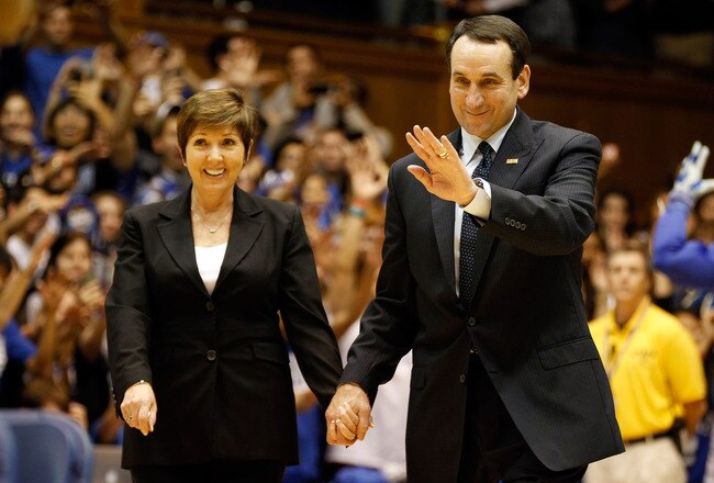DURHAM, NC - NOVEMBER 18:  Head coach Mike Krzyzewski of the Duke Blue Devils stands with his wife Micki as he is acknowledged for breaking the record for wins in NCAA men's basketball at Cameron Indoor Stadium on November 18, 2011 in Durham, North Carolina.  (Photo by Streeter Lecka/Getty Images)