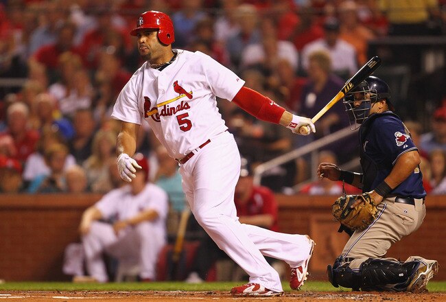 ST. LOUIS - SEPTEMBER 17: Albert Pujols #5 of the St. Louis Cardinals hits an RBI double against the San Diego Padres at Busch Stadium on September 17, 2010 in St. Louis, Missouri.  (Photo by Dilip Vishwanat/Getty Images)