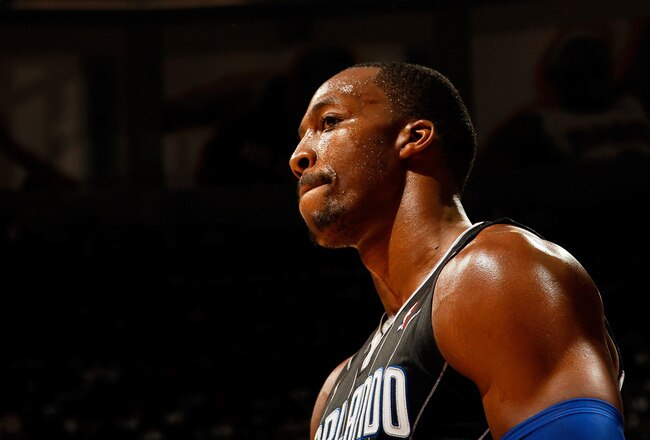 ATLANTA, GA - APRIL 28:  Dwight Howard #12 of the Orlando Magic reacts after a turnover to the Atlanta Hawks during Game Six of the Eastern Conference Quarterfinals in the 2011 NBA Playoffs at Philips Arena on April 28, 2011 in Atlanta, Georgia.  NOTE TO USER: User expressly acknowledges and agrees that, by downloading and or using this photograph, User is consenting to the terms and conditions of the Getty Images License Agreement.  (Photo by Kevin C. Cox/Getty Images)