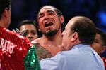 NEW YORK, NY - DECEMBER 03:  Antonio Margarito of Mexico reacts after referee Steve Smoger (R) calls the fight due to Margarito's closed right eye against Miguel Cotto of Puerto Rico in the tenth round during the WBA World Junior Middleweight Title fight at Madison Square Garden on December 3, 2011 in New York City.  (Photo by Al Bello/Getty Images)
