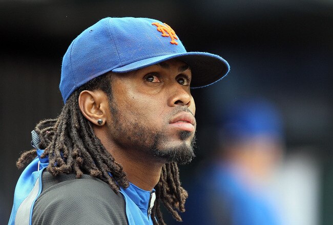 NEW YORK, NY - SEPTEMBER 28:  Jose Reyes #7 (R) of the New York Mets looks on from the dugout during the ninth inning against the Cincinnati Reds at Citi Field on September 28, 2011 in the Flushing neighborhood of the Queens borough of New York City. The Mets defeated the Reds 3-0. Reyes is an unrestricted free agent at the end of the season. Reyes also ended the game with a narrow lead for the National League batting title.  (Photo by Jim McIsaac/Getty Images)