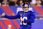 EAST RUTHERFORD, NJ - DECEMBER 04:  Eli Manning #10 of the New York Giants celebrates after Brandon Jacobs #27 scored a 1-yard rushing touchdown in the second quarter against the Green Bay Packers at MetLife Stadium on December 4, 2011 in East Rutherford, New Jersey.  (Photo by Chris Trotman/Getty Images)